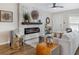 Inviting living space featuring a fireplace with a modern stone surround, stylish furniture, and hardwood floors at 701 38Th N Ave, St Petersburg, FL 33704