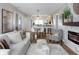 Open-concept living room seamlessly connects to dining area and kitchen, offering a spacious and modern layout at 701 38Th N Ave, St Petersburg, FL 33704
