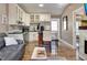 Open living room with modern appliances, marble countertops and backsplash, and a cozy breakfast nook at 701 38Th N Ave, St Petersburg, FL 33704