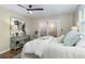 Main bedroom features a ceiling fan and sliding doors to the exterior at 701 38Th N Ave, St Petersburg, FL 33704