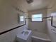 Well-lit bathroom features a vanity and a shower-tub combo at 718 Paris S Ave, St Petersburg, FL 33701