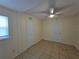 Clean bedroom with tile flooring, a ceiling fan, and a closet for storage at 718 Paris S Ave, St Petersburg, FL 33701