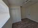 Bedroom featuring wood-look floors, ceiling fan, and closet space at 718 Paris S Ave, St Petersburg, FL 33701