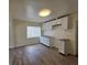 Bright kitchenette featuring white cabinetry and tile flooring at 718 Paris S Ave, St Petersburg, FL 33701