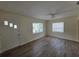 Cozy living room with natural light and wood-look floors at 718 Paris S Ave, St Petersburg, FL 33701