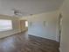 Spacious living room features wood-look floors and a ceiling fan at 718 Paris S Ave, St Petersburg, FL 33701