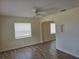 Bright living room with plenty of natural light and durable wood-look flooring at 718 Paris S Ave, St Petersburg, FL 33701