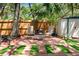 The backyard boasts a seating area with fire pit, privacy fence, and shed for storage at 7203 55Th N Ave, St Petersburg, FL 33709