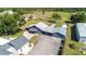 Aerial view of property shows a horse corral, outbuildings, and landscaping at 812 Jameson Rd, Lithia, FL 33547