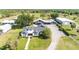 Aerial view of a single Gathering home with well-kept landscaping and multiple outbuildings at 812 Jameson Rd, Lithia, FL 33547