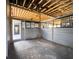 Interior barn featuring a ceiling fan and horse stall with metal grid flooring at 812 Jameson Rd, Lithia, FL 33547