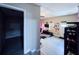 This bedroom features a window, tile floors, and a door at 812 Jameson Rd, Lithia, FL 33547