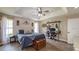 Bedroom with desk, trey ceilings, two windows, and a fan at 812 Jameson Rd, Lithia, FL 33547