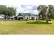 Well-maintained home on expansive lawn with fenced yard and classic architectural details at 812 Jameson Rd, Lithia, FL 33547