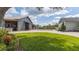 Beautiful exterior of the property with well-maintained lawn, various buildings, and mature landscaping at 812 Jameson Rd, Lithia, FL 33547