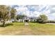 Lovely home with manicured lawn, dormer windows, and stone path, set on a spacious lot with mature trees at 812 Jameson Rd, Lithia, FL 33547