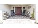 Inviting front porch with decorative tile, comfortable rocking chairs, and charming potted plants at 812 Jameson Rd, Lithia, FL 33547