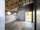 Horse stall with metal flooring and partial walls with metal bars to contain livestock at 812 Jameson Rd, Lithia, FL 33547