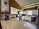 Kitchen with updated appliances, countertops, and a unique metal ceiling; stylish and functional at 812 Jameson Rd, Lithia, FL 33547