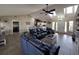 Open-concept living room with vaulted ceilings, tile floors, and a comfortable seating area at 812 Jameson Rd, Lithia, FL 33547