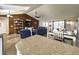 Large living room with wood accent wall, open to the dining area and kitchen; lots of natural light at 812 Jameson Rd, Lithia, FL 33547