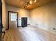 A spare room, possibly an office, with a security safe, laminate floors, and track lighting at 812 Jameson Rd, Lithia, FL 33547