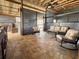 Covered outdoor living area includes outdoor seating, a ceiling fan, and access to the outdoor kitchen at 812 Jameson Rd, Lithia, FL 33547