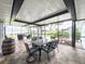 A covered patio featuring outdoor furniture and views of the backyard at 812 Jameson Rd, Lithia, FL 33547
