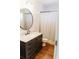 Bathroom featuring modern vanity with mirror, with a shower and toilet area at 8338 Old Town Dr, Tampa, FL 33647