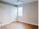 This is a clean, uncluttered bedroom with simple decor and wood floors at 8338 Old Town Dr, Tampa, FL 33647