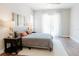 Inviting bedroom filled with natural light features wood floors and access to a private balcony at 8338 Old Town Dr, Tampa, FL 33647