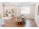 Elegant dining room with modern chandelier, hardwood floors, and natural light at 8338 Old Town Dr, Tampa, FL 33647