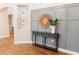 Hallway with decorative wainscoting, console table, and niche for decor at 8338 Old Town Dr, Tampa, FL 33647