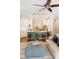 Open kitchen with white cabinets, breakfast bar seating, and pendant lighting at 8338 Old Town Dr, Tampa, FL 33647
