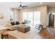 Living room with hardwood floors, a comfortable seating area, and access to a patio at 8338 Old Town Dr, Tampa, FL 33647