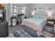 Stylish bedroom with an accent rug, dedicated desk space, and ample natural light at 8717 Emeraldwood Way, Land O Lakes, FL 34637