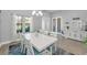 Elegant dining room with a spacious table and plenty of natural light at 8717 Emeraldwood Way, Land O Lakes, FL 34637