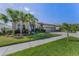 Inviting exterior view of home with a well-maintained lawn and attractive landscaping details at 8717 Emeraldwood Way, Land O Lakes, FL 34637