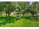 Scenic park gazebo surrounded by lush greenery, mature trees, and walking paths for relaxation at 8717 Emeraldwood Way, Land O Lakes, FL 34637