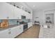 Modern kitchen features a tiled backsplash, granite counters, and stainless steel appliances at 8717 Emeraldwood Way, Land O Lakes, FL 34637