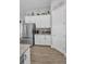 Kitchen features stainless steel appliances, granite countertops, and white cabinetry at 8717 Emeraldwood Way, Land O Lakes, FL 34637