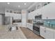 Well-equipped kitchen with stainless steel appliances and spacious granite countertop at 8717 Emeraldwood Way, Land O Lakes, FL 34637