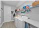 Functional laundry room with modern appliances and plenty of storage space at 8717 Emeraldwood Way, Land O Lakes, FL 34637