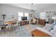 Living room with a round rug, entertainment center, and barstool seating at 8717 Emeraldwood Way, Land O Lakes, FL 34637