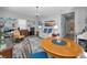 Living room offers a table and chairs for four, a ceiling fan, and a buffet at 8717 Emeraldwood Way, Land O Lakes, FL 34637