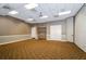 Meeting room with neutral walls, carpet, drop ceiling, and a refreshment station at 8717 Emeraldwood Way, Land O Lakes, FL 34637
