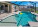 Beautiful pool with a screened enclosure, clear blue water, and a relaxing spa, perfect for outdoor enjoyment at 8717 Emeraldwood Way, Land O Lakes, FL 34637