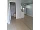 Small apartment with tiled flooring, bathroom, mini split AC, and kitchen appliances at 8728 Mcadam Pl, Tampa, FL 33634