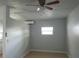 Bright room featuring neutral walls, tile flooring and a ceiling fan with a window at 8728 Mcadam Pl, Tampa, FL 33634