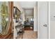 Inviting entryway with decorative mirror, console table, and tiled floor at 8728 Mcadam Pl, Tampa, FL 33634